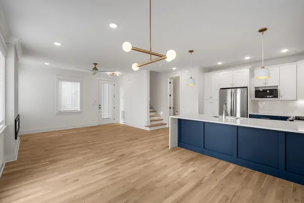 a view of kitchen and wooden floor