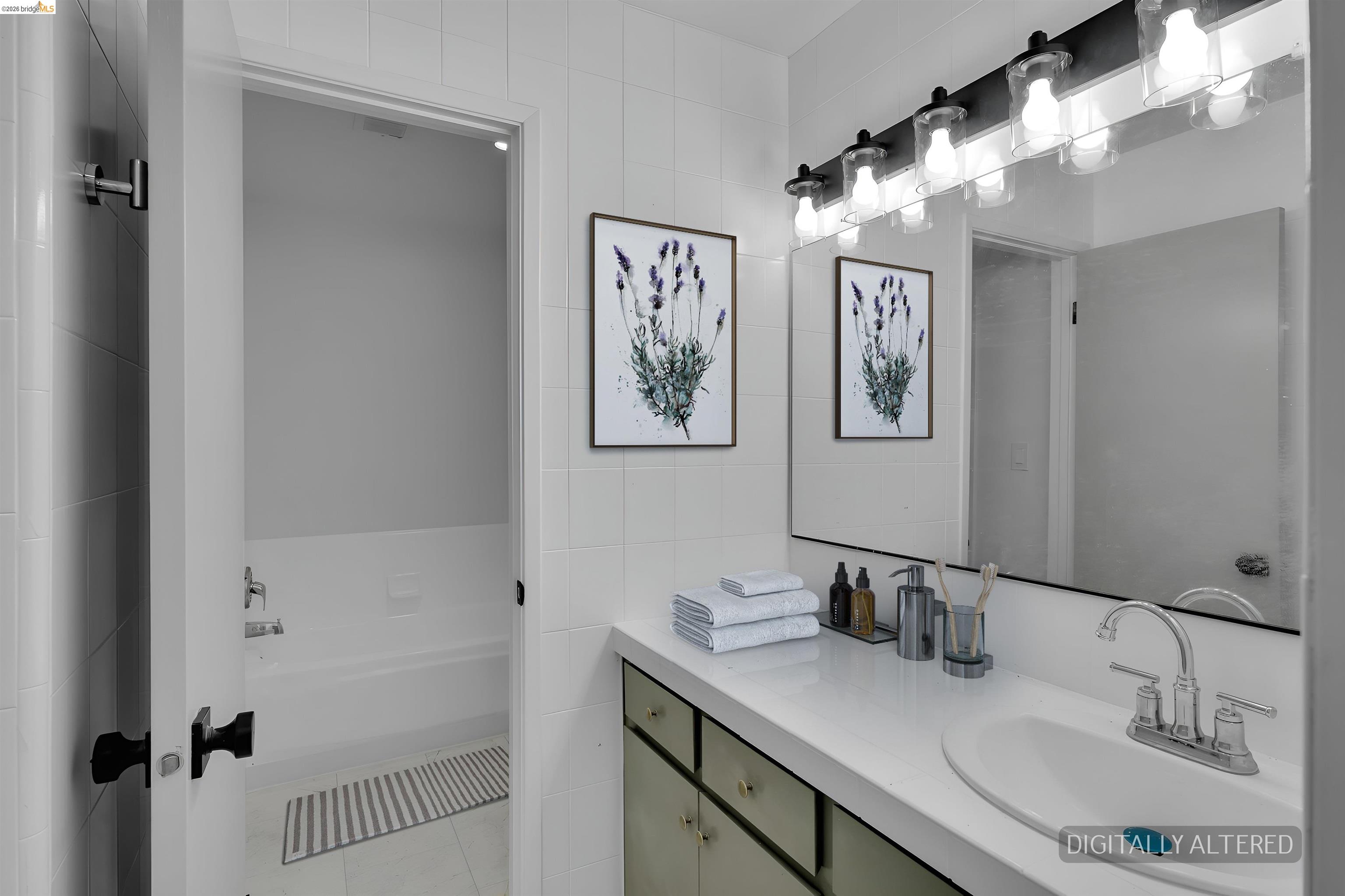 1808 Wildbrook Court, Unit D Concord, CA 94521 - Photo 36 of 47 a bathroom with a sink and a mirror