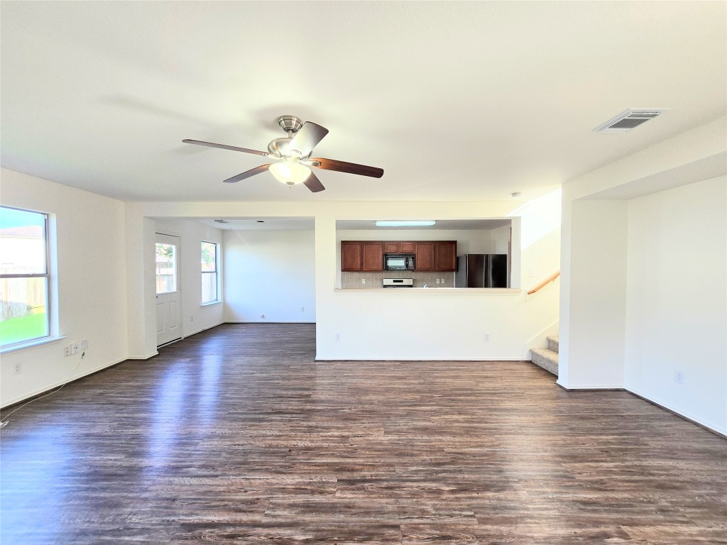 22911 Twisting Maple Court Spring, TX 77373 - Photo 11 of 37 a view of an empty room with window and wooden floor