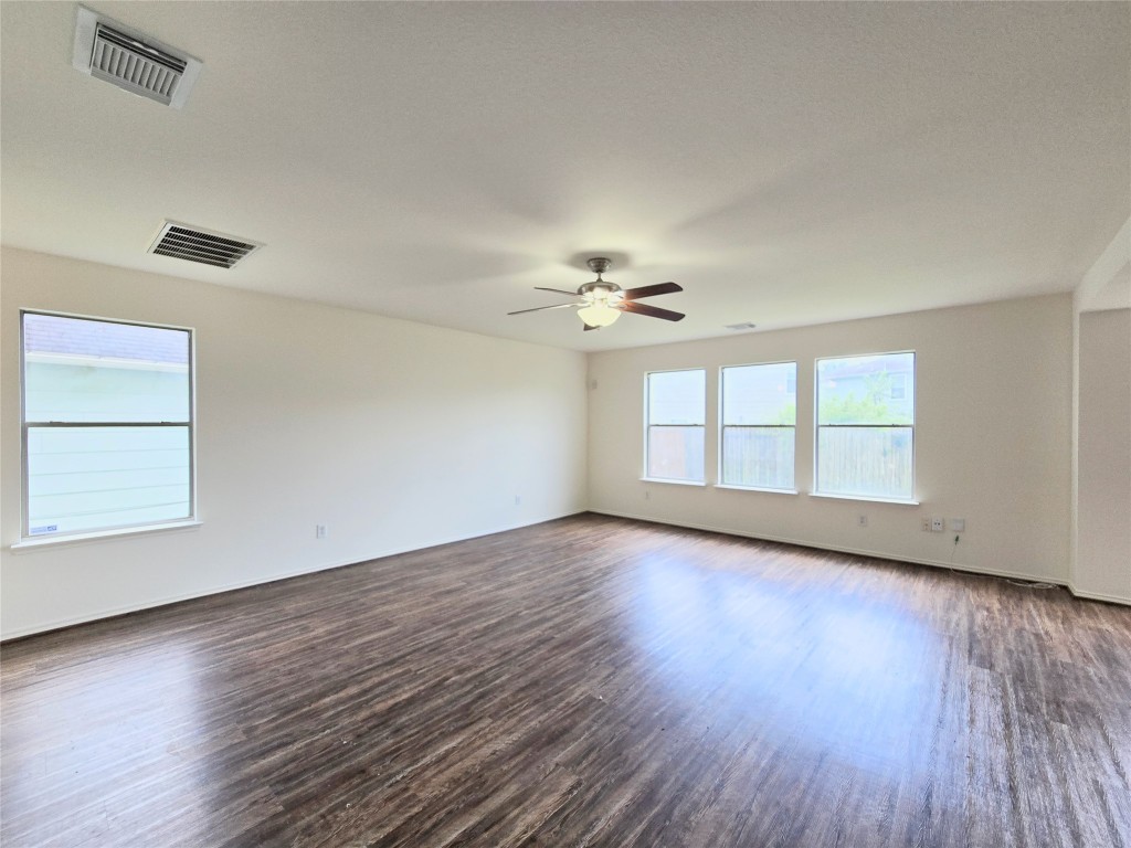 22911 Twisting Maple Court Spring, TX 77373 - Photo 15 of 37 a view of an empty room with wooden floor and a window