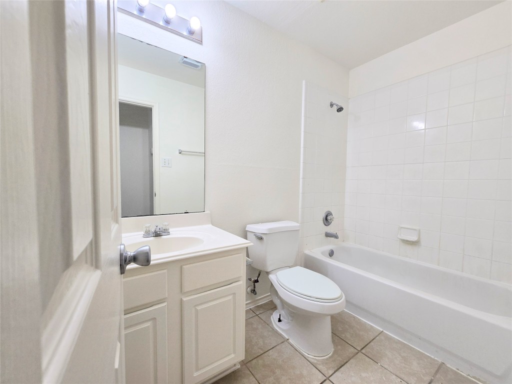 22911 Twisting Maple Court Spring, TX 77373 - Photo 33 of 37 a bathroom with a sink a toilet and a bathtub