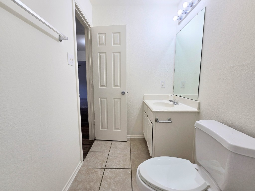 22911 Twisting Maple Court Spring, TX 77373 - Photo 34 of 37 a white toilet sitting next to a bathroom sink