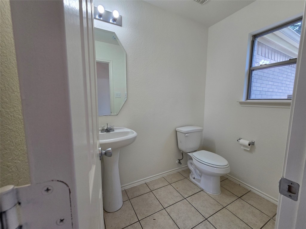 22911 Twisting Maple Court Spring, TX 77373 - Photo 35 of 37 a bathroom with a sink toilet and a mirror