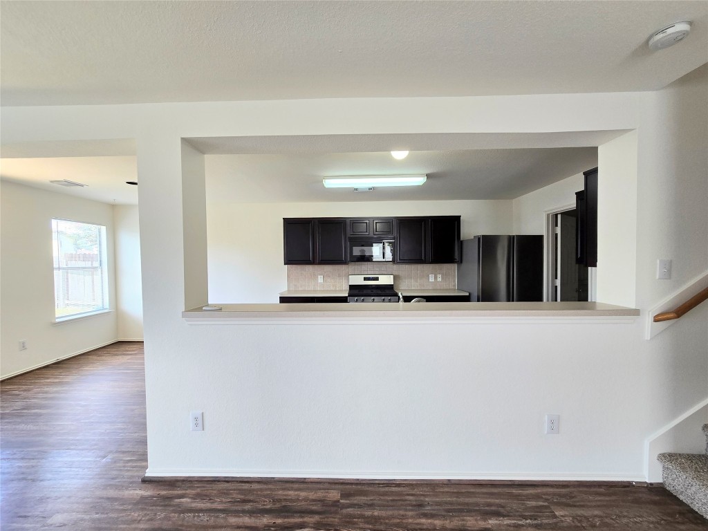 22911 Twisting Maple Court Spring, TX 77373 - Photo 37 of 37 a view of kitchen with stainless steel appliances wooden floor and window