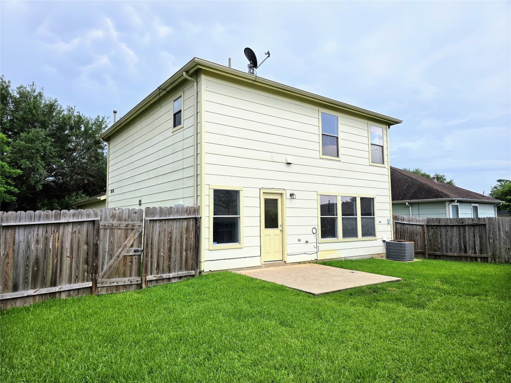 22911 Twisting Maple Court Spring, TX 77373 - Photo 4 of 37 a front view of a house with a yard