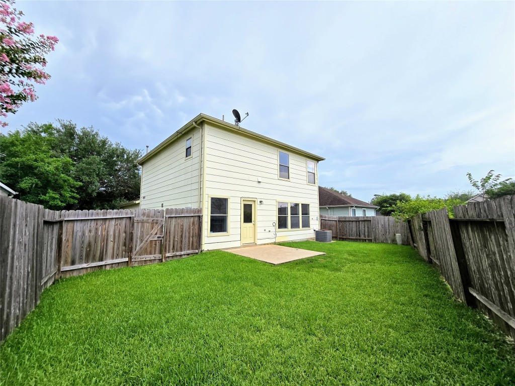 22911 Twisting Maple Court Spring, TX 77373 - Photo 5 of 37 a view of a house with a yard and sitting area