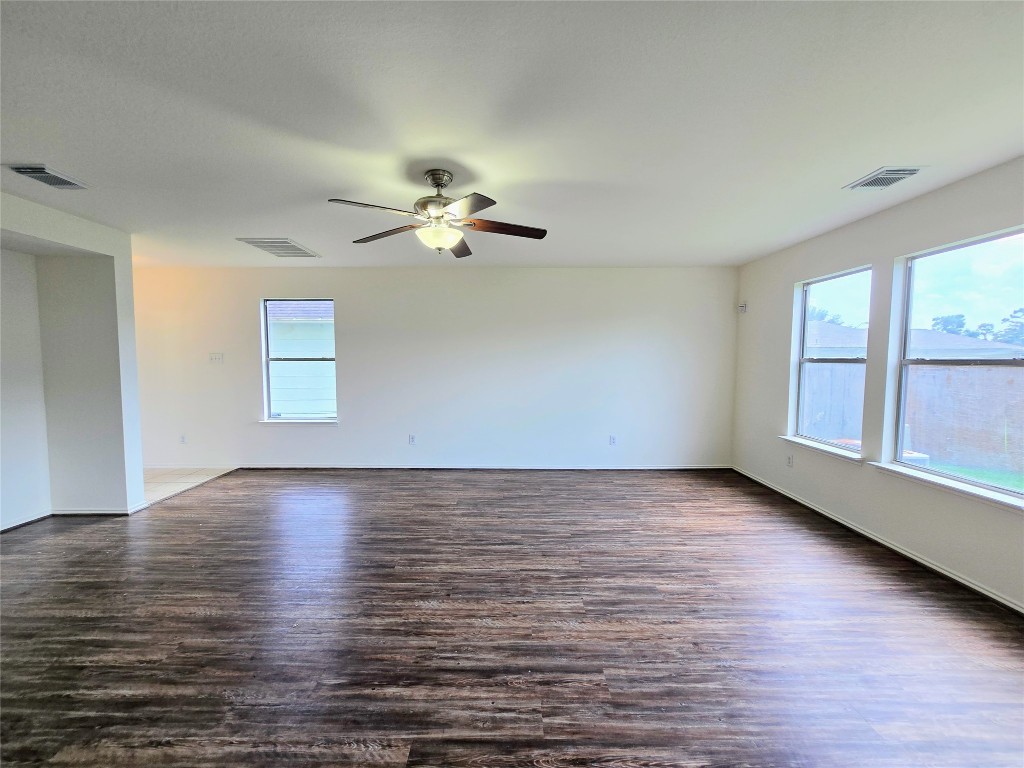 22911 Twisting Maple Court Spring, TX 77373 - Photo 8 of 37 an empty room with wooden floor and window