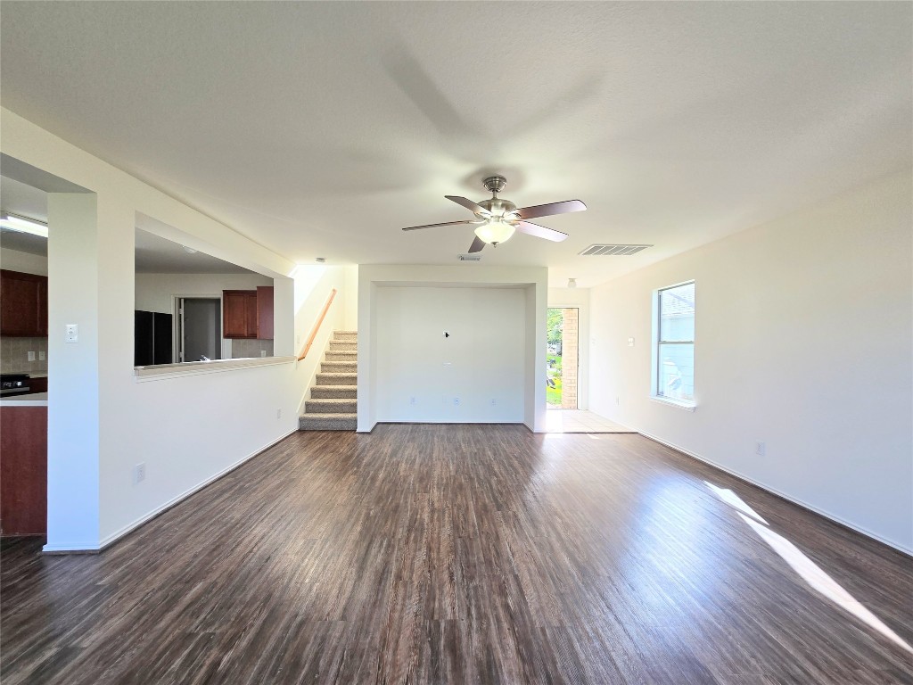 22911 Twisting Maple Court Spring, TX 77373 - Photo 10 of 37 a view of an empty room with wooden floor and a window