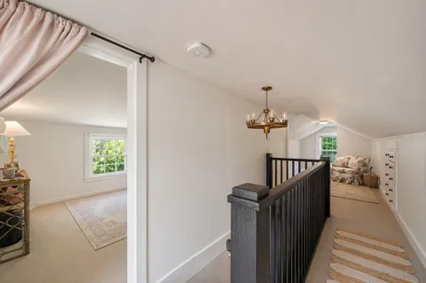 a view of a hallway view with staircase