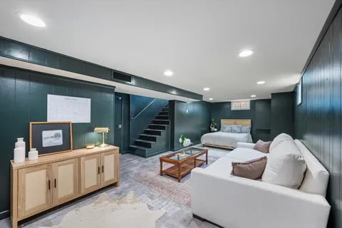 a living room with furniture and a projector