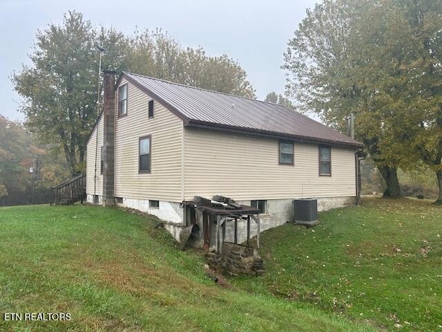 4551 Upper Crab Road Jamestown, TN 38556 - Photo 22 of 22 a backyard of a house with table and chairs