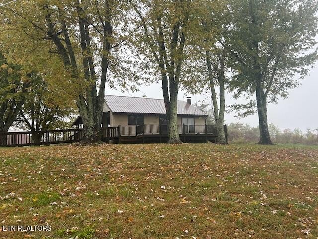 4551 Upper Crab Road Jamestown, TN 38556 - Photo 3 of 22 a front view of a house with a yard and garage