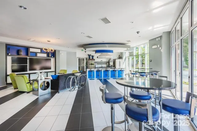 a kitchen with stainless steel appliances granite countertop a stove and a refrigerator