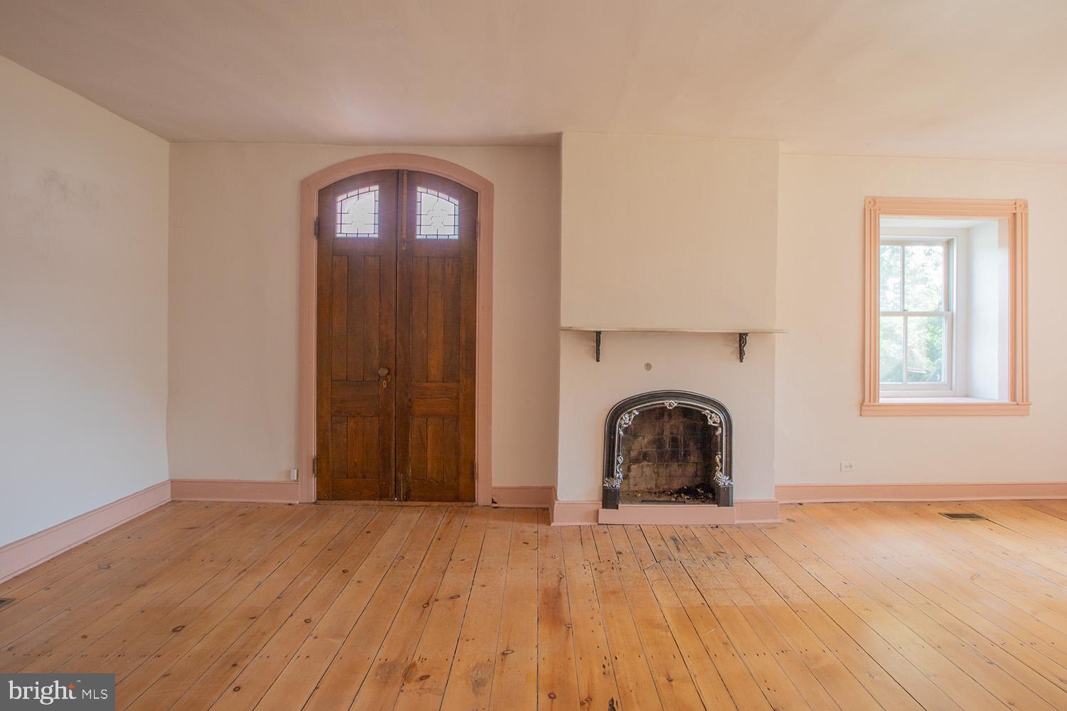385 Albright Road Kutztown, PA 19530 - Photo 14 of 36 a view of a livingroom with wooden floor and a fireplace