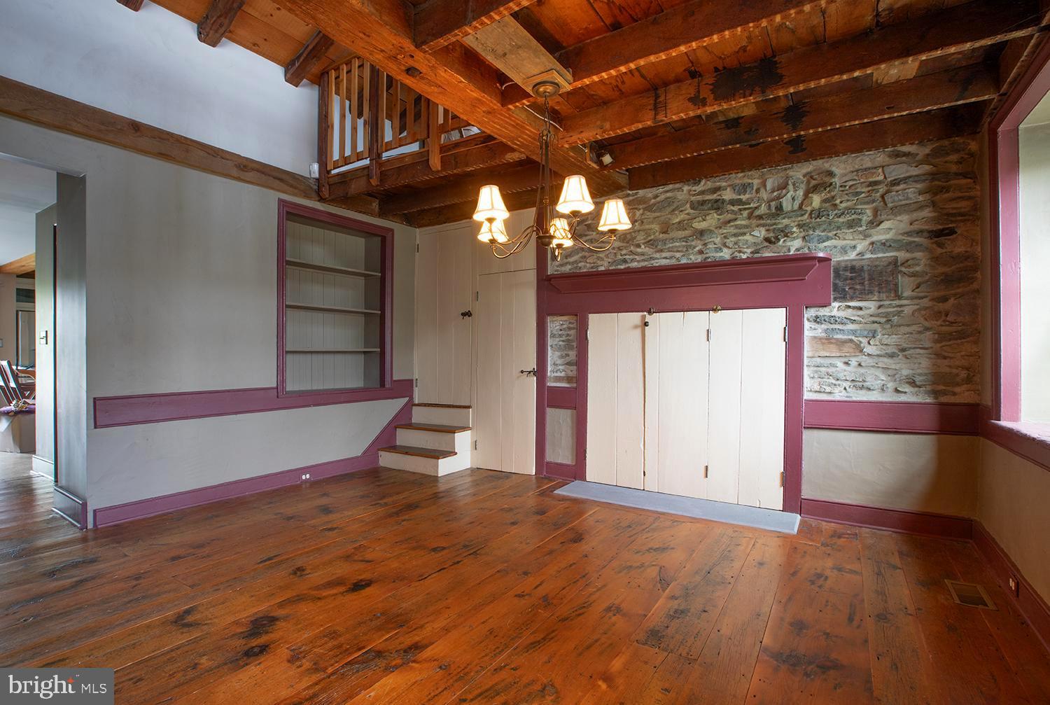 385 Albright Road Kutztown, PA 19530 - Photo 19 of 36 an empty room with wooden floor and windows