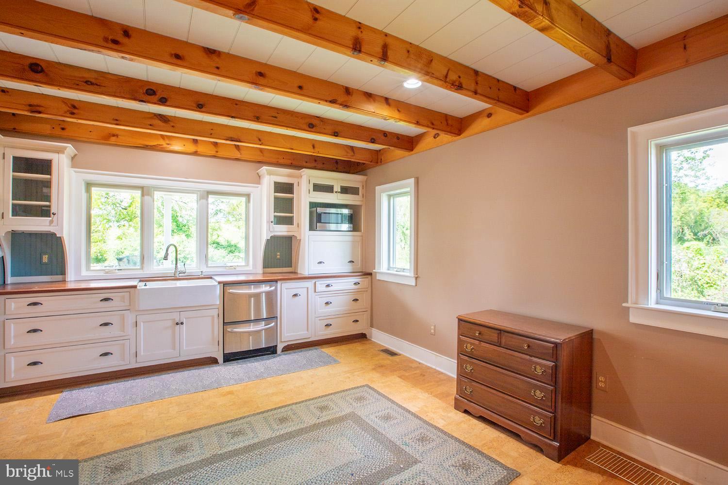 385 Albright Road Kutztown, PA 19530 - Photo 27 of 36 a spacious bathroom with a window double vanity and a bathtub