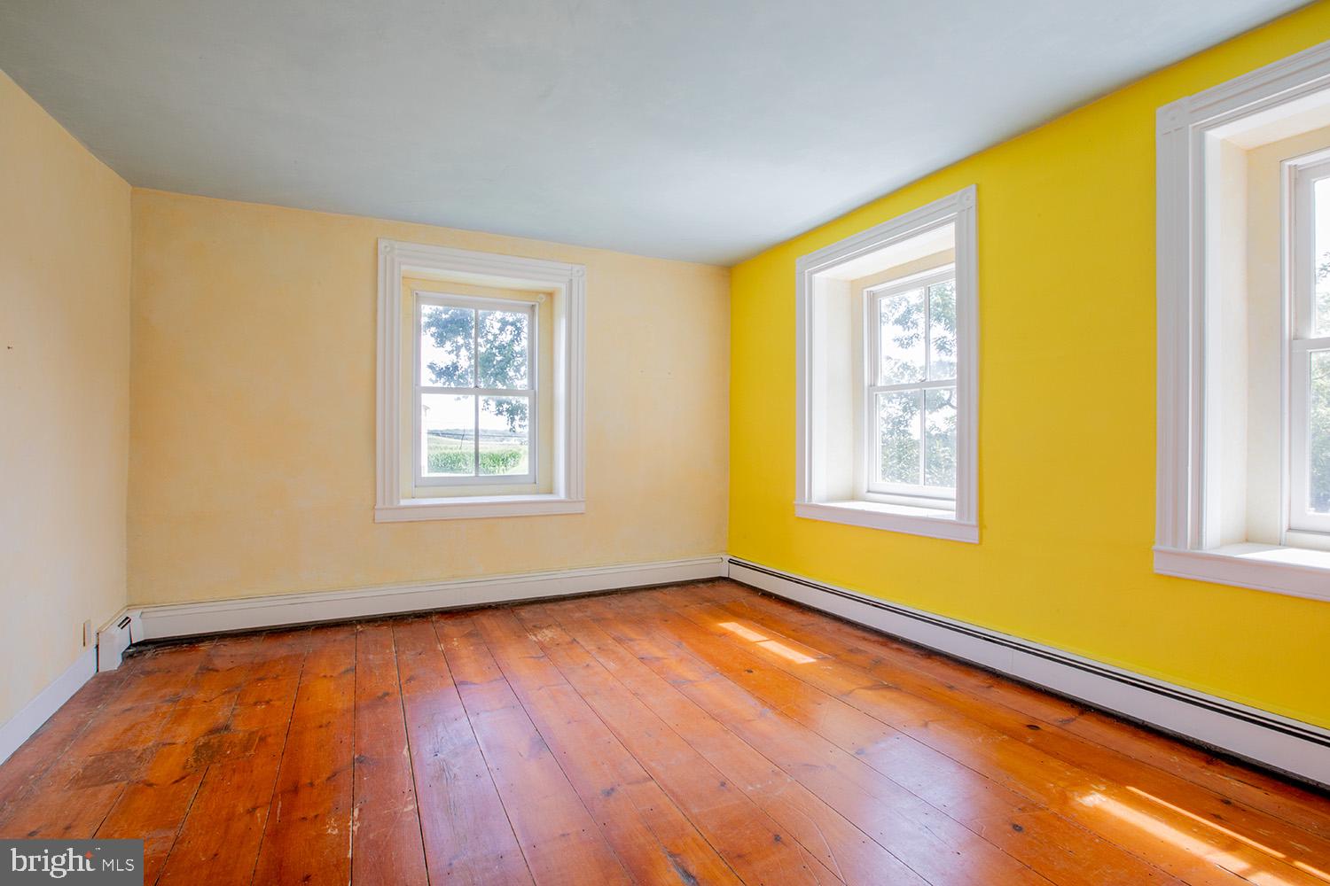 385 Albright Road Kutztown, PA 19530 - Photo 29 of 36 a view of an empty room with window and wooden floor