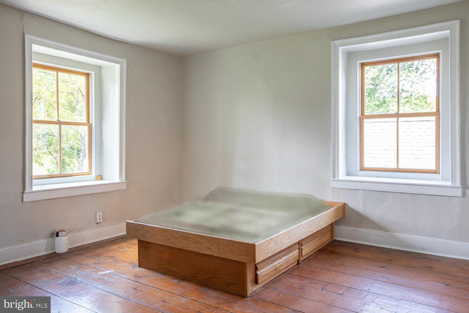 385 Albright Road Kutztown, PA 19530 - Photo 30 of 36 a view of an empty room with wooden floor and a window