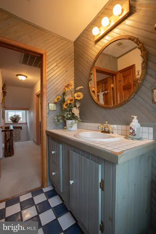 a bathroom with a sink and a mirror