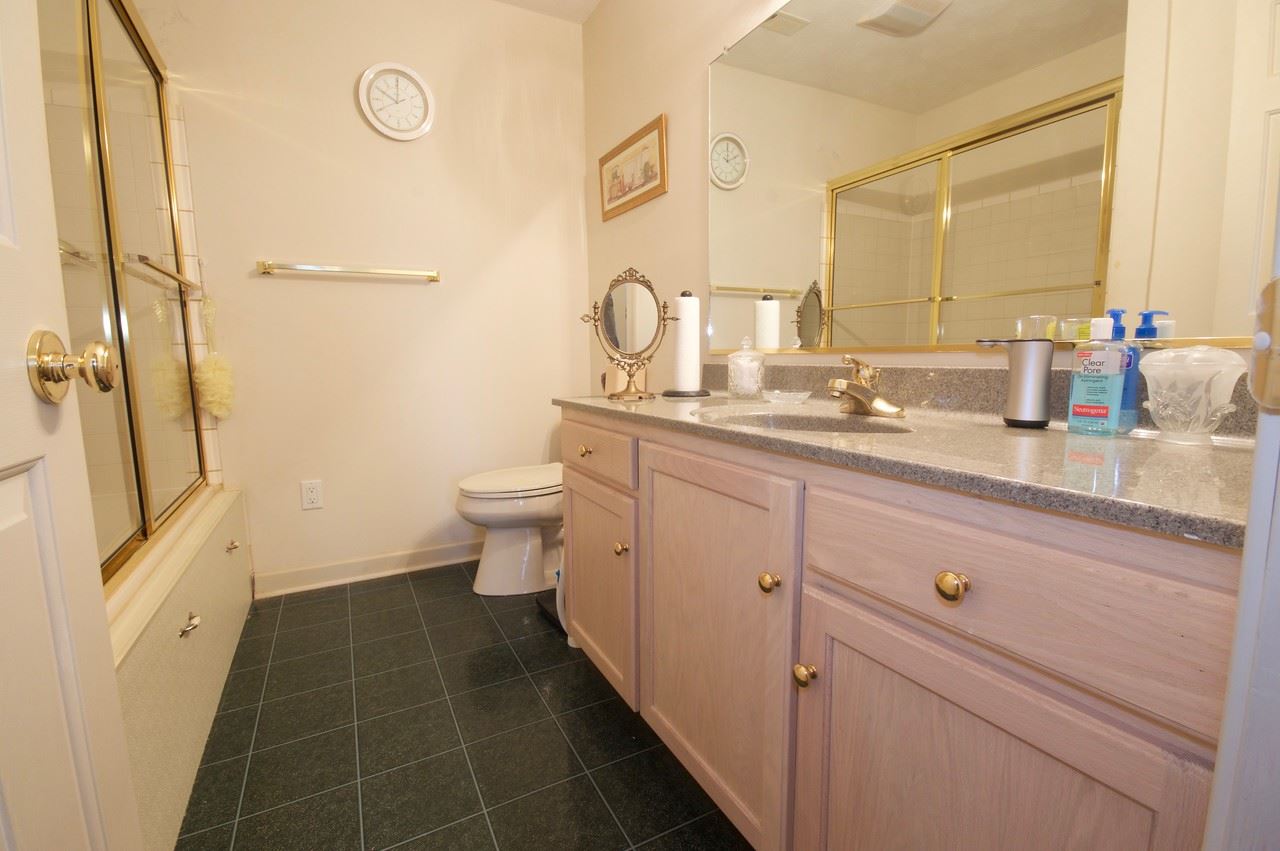 400 Cedar Green Road Staunton, VA 24401 - Photo 44 of 49 a bathroom with a granite countertop sink a toilet a mirror and shower