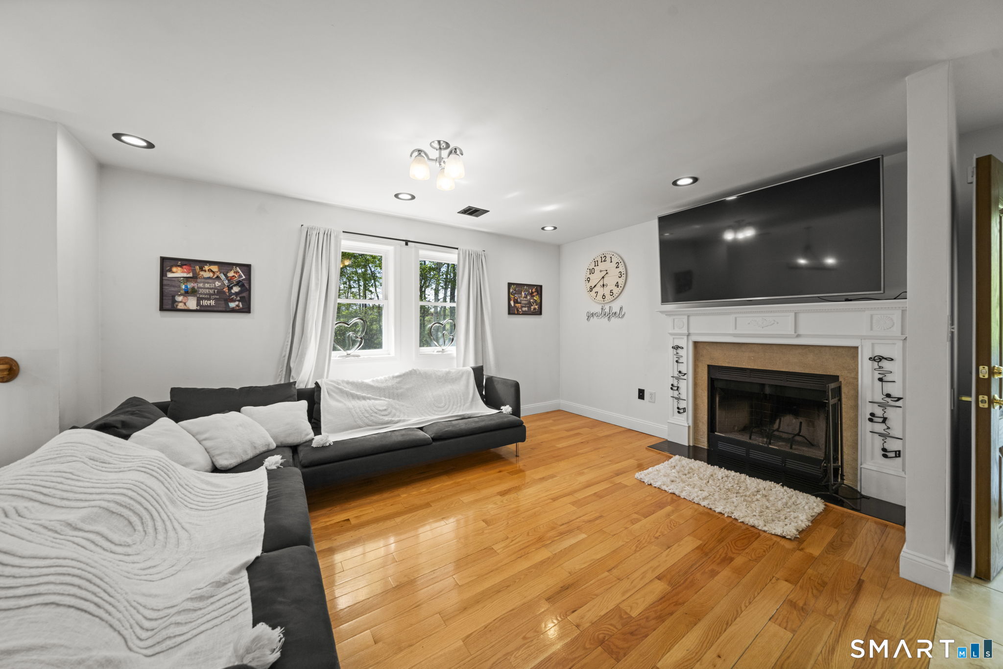1118 Spindle Hill Road Wolcott, CT 06716 - Photo 14 of 38 a bedroom with a bed and a flat screen tv