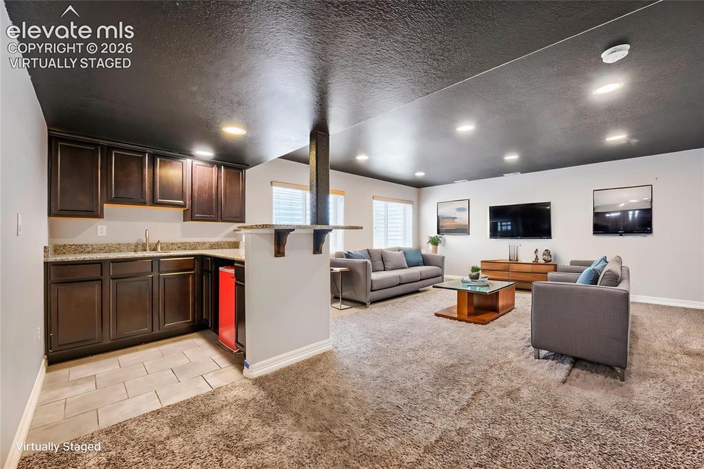 10202 Boulder Ridge Drive Peyton, CO 80831 - Photo 26 of 40 Virtually Staged Basement Family Room
