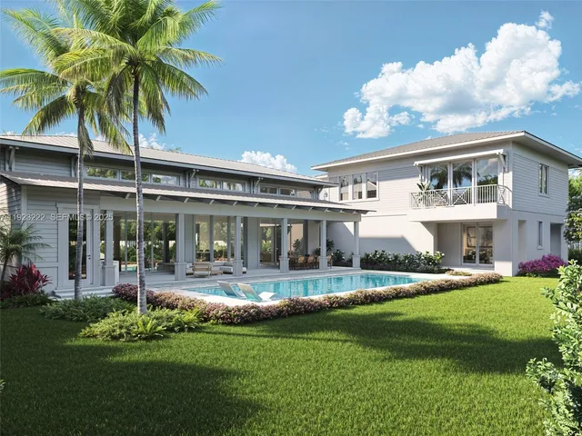 a front view of house with yard and outdoor seating