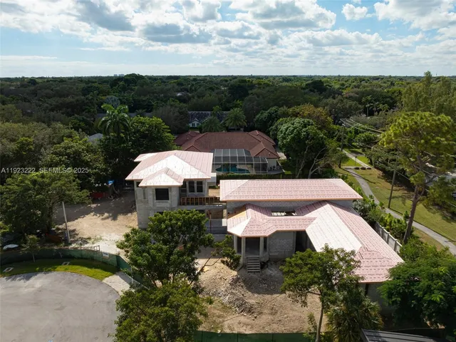 an aerial view of a house with a garden
