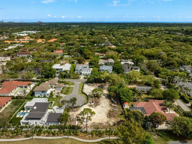 an aerial view of houses with yard