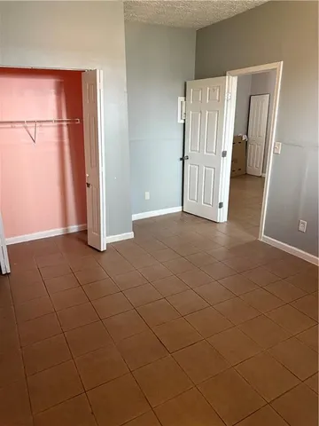 an empty room with a bathroom