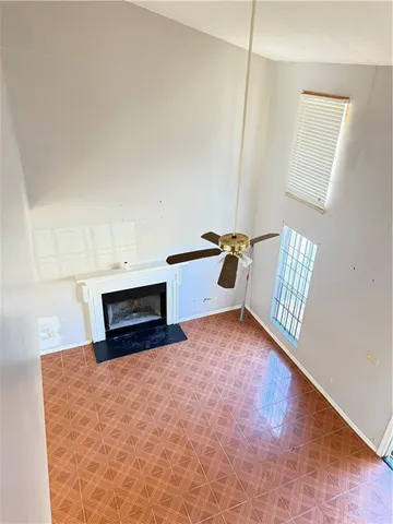 a kitchen with granite countertop a refrigerator and a sink