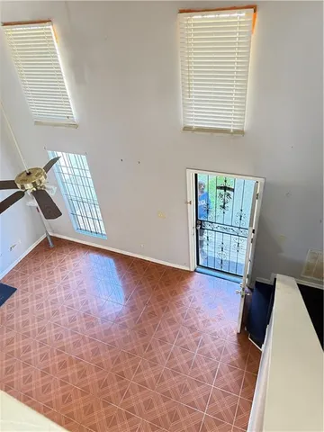 a view of an empty room and a window