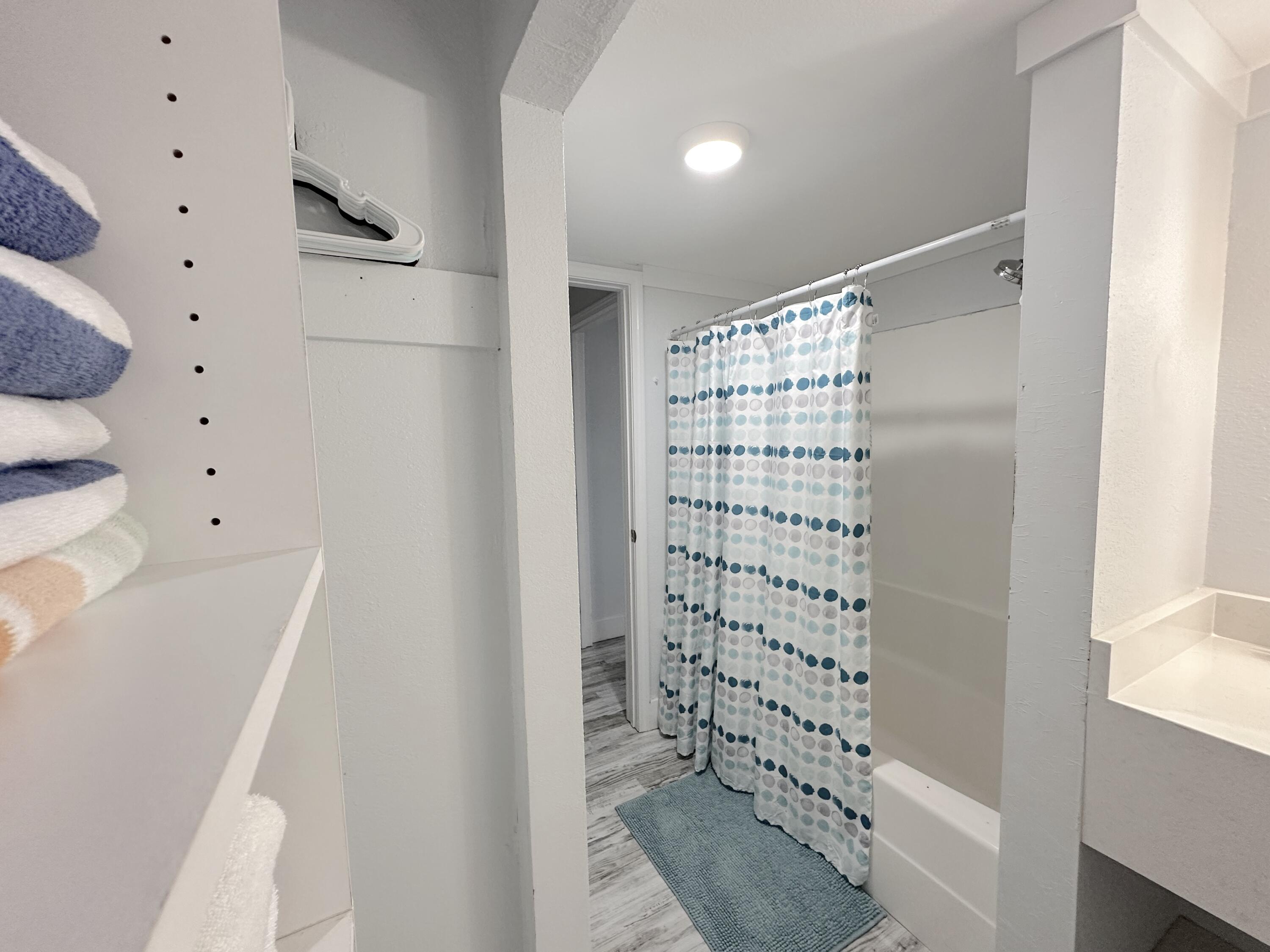 4000 Gulf Terrace Drive, Unit 1000 Destin, FL 32541 - Photo 13 of 37 a bathroom with a bathtub and shower