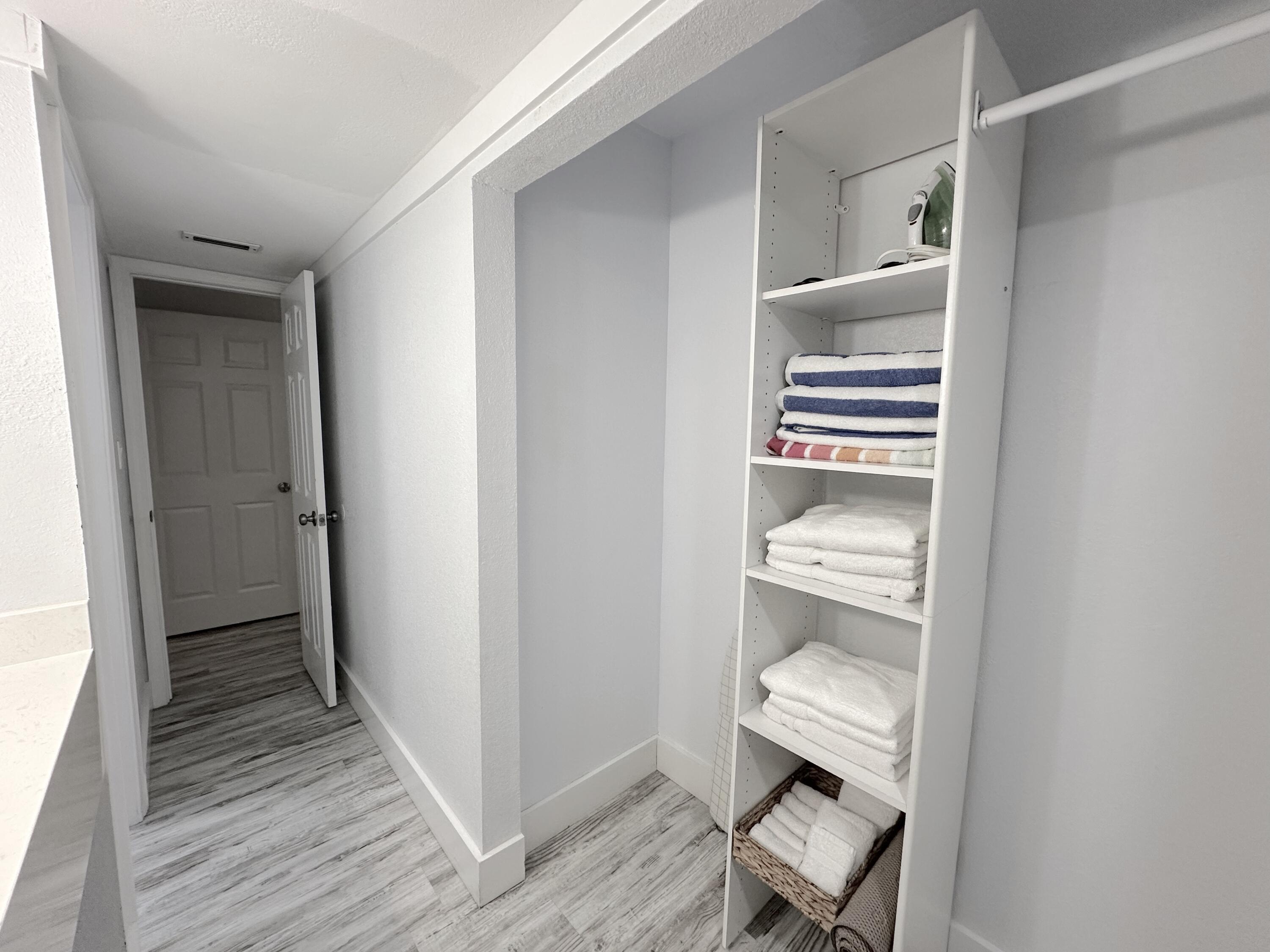 4000 Gulf Terrace Drive, Unit 1000 Destin, FL 32541 - Photo 15 of 37 a room with a bench and dryer