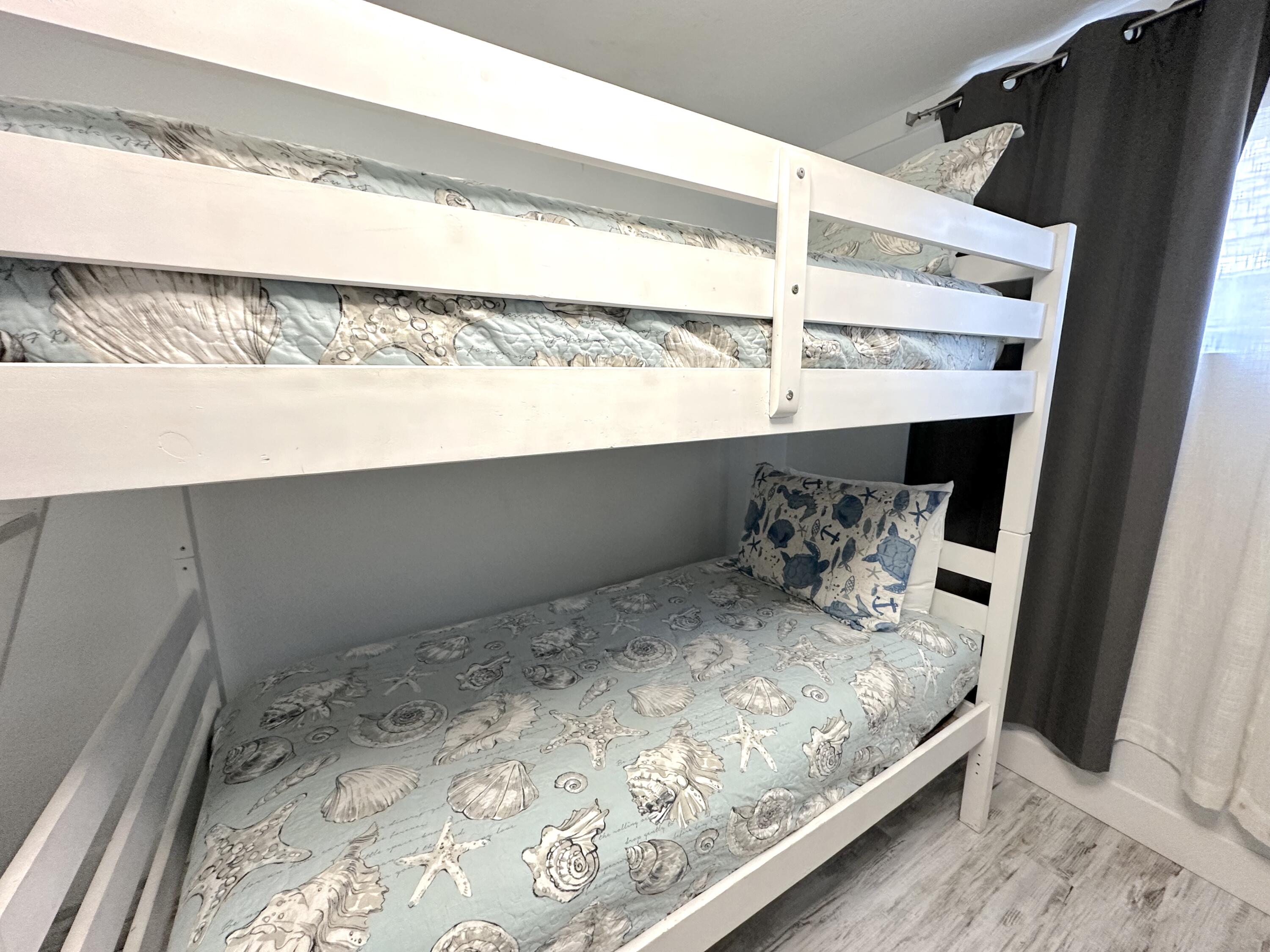 4000 Gulf Terrace Drive, Unit 1000 Destin, FL 32541 - Photo 19 of 37 a bed sitting in a bedroom next to a window