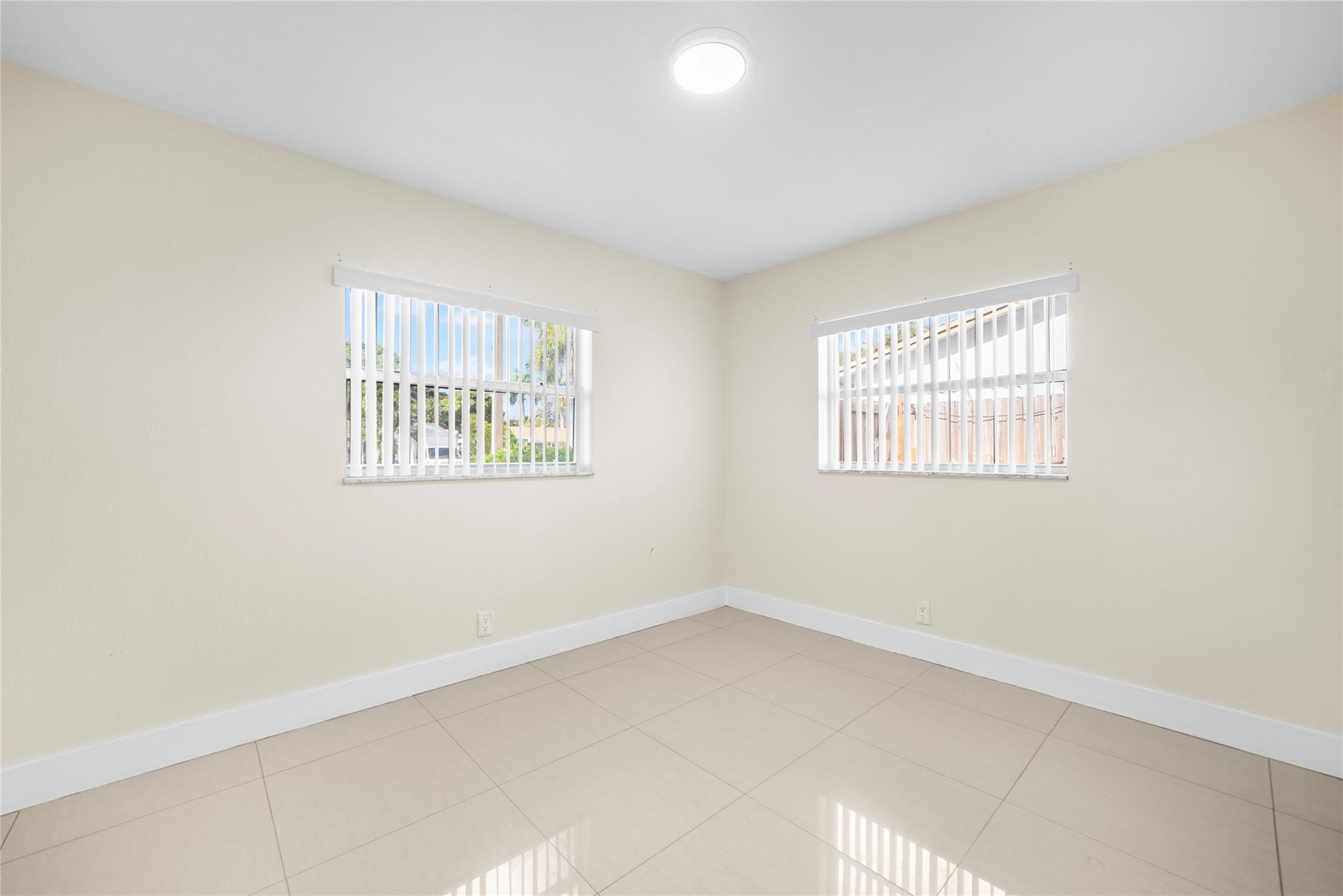 520 Southwest 72nd Terrace North Lauderdale, FL 33068 - Photo 14 of 35 an empty room with windows