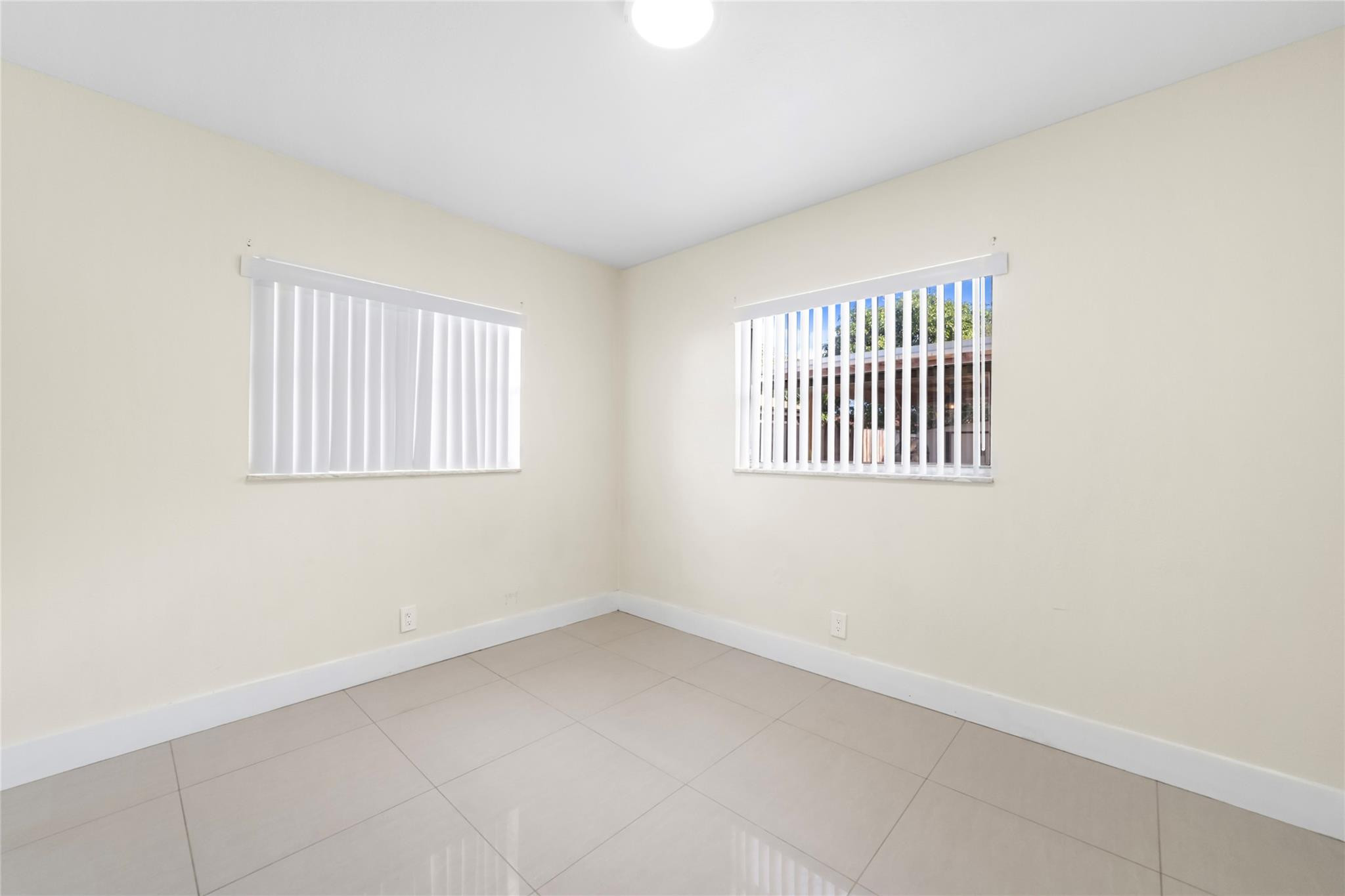520 Southwest 72nd Terrace North Lauderdale, FL 33068 - Photo 15 of 35 an empty room with windows