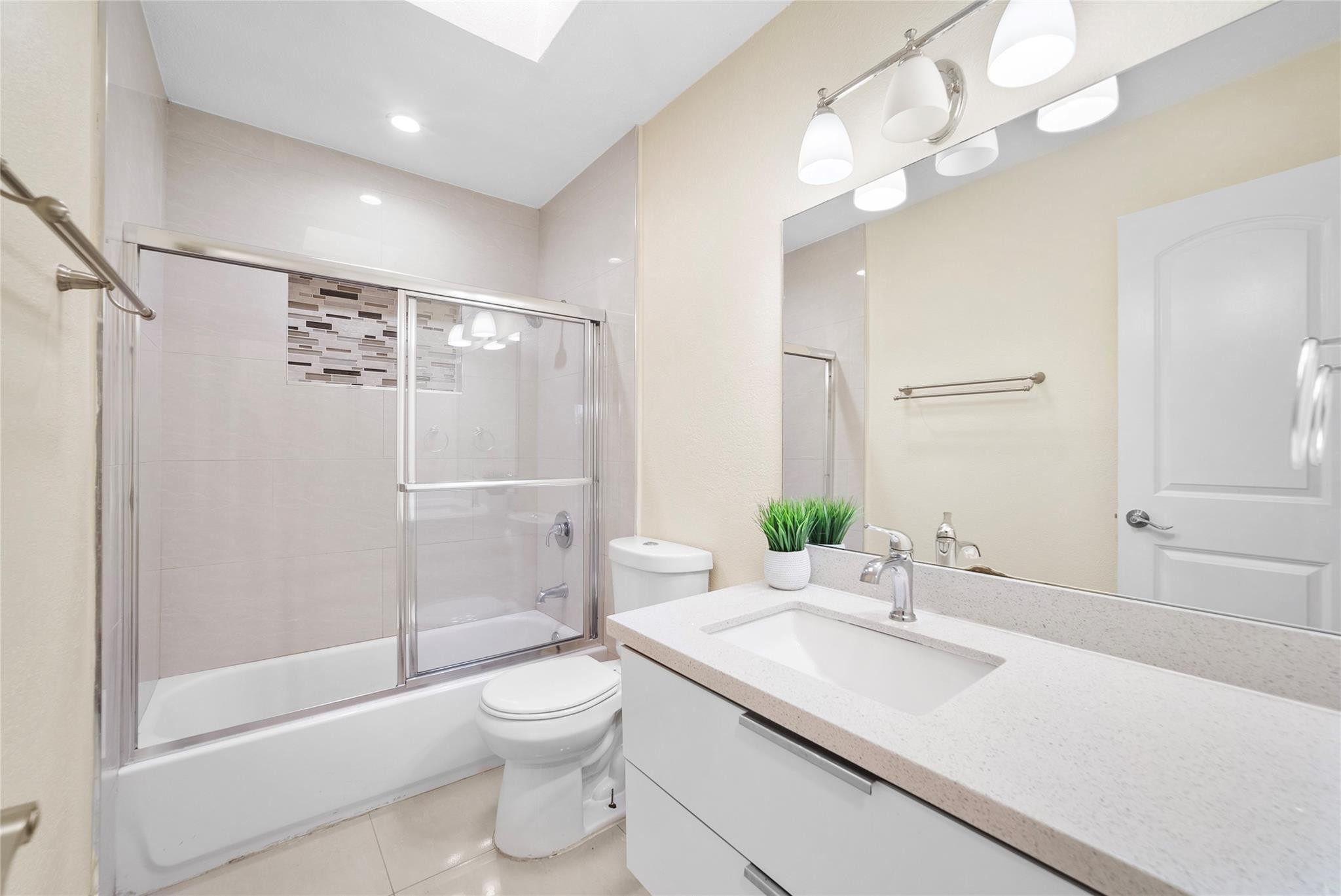 520 Southwest 72nd Terrace North Lauderdale, FL 33068 - Photo 17 of 35 a bathroom with a sink a toilet and shower