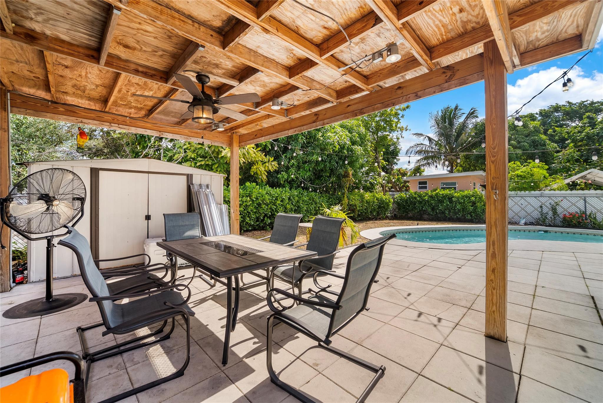 520 Southwest 72nd Terrace North Lauderdale, FL 33068 - Photo 23 of 35 a view of a patio with table and chairs with wooden floor and fence