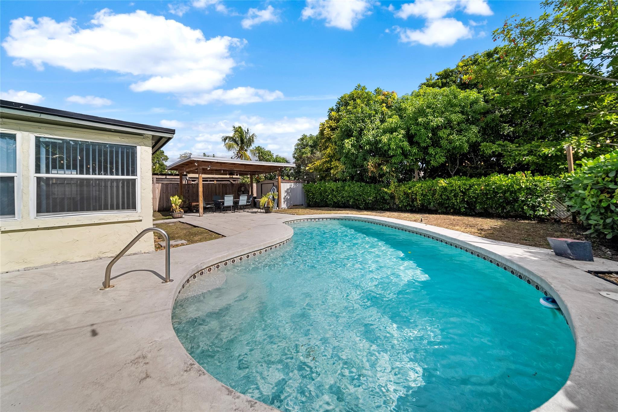 520 Southwest 72nd Terrace North Lauderdale, FL 33068 - Photo 26 of 35 a view of a house with swimming pool and sitting area