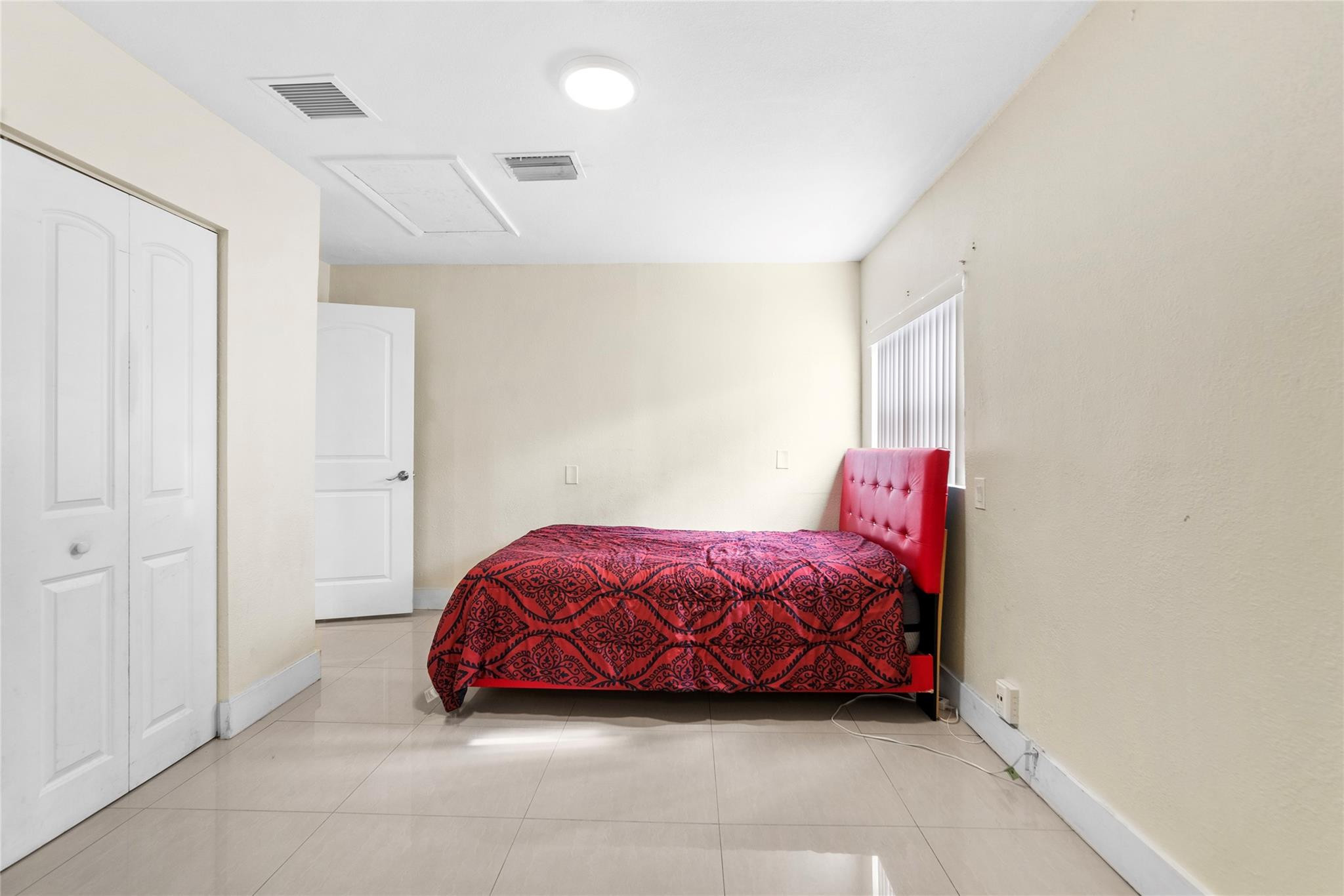 520 Southwest 72nd Terrace North Lauderdale, FL 33068 - Photo 29 of 35 a bedroom with a bed and a wall painting