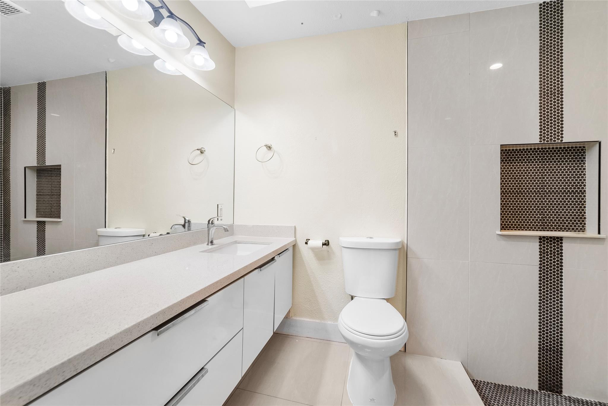 520 Southwest 72nd Terrace North Lauderdale, FL 33068 - Photo 30 of 35 a bathroom with a sink a toilet and a mirror