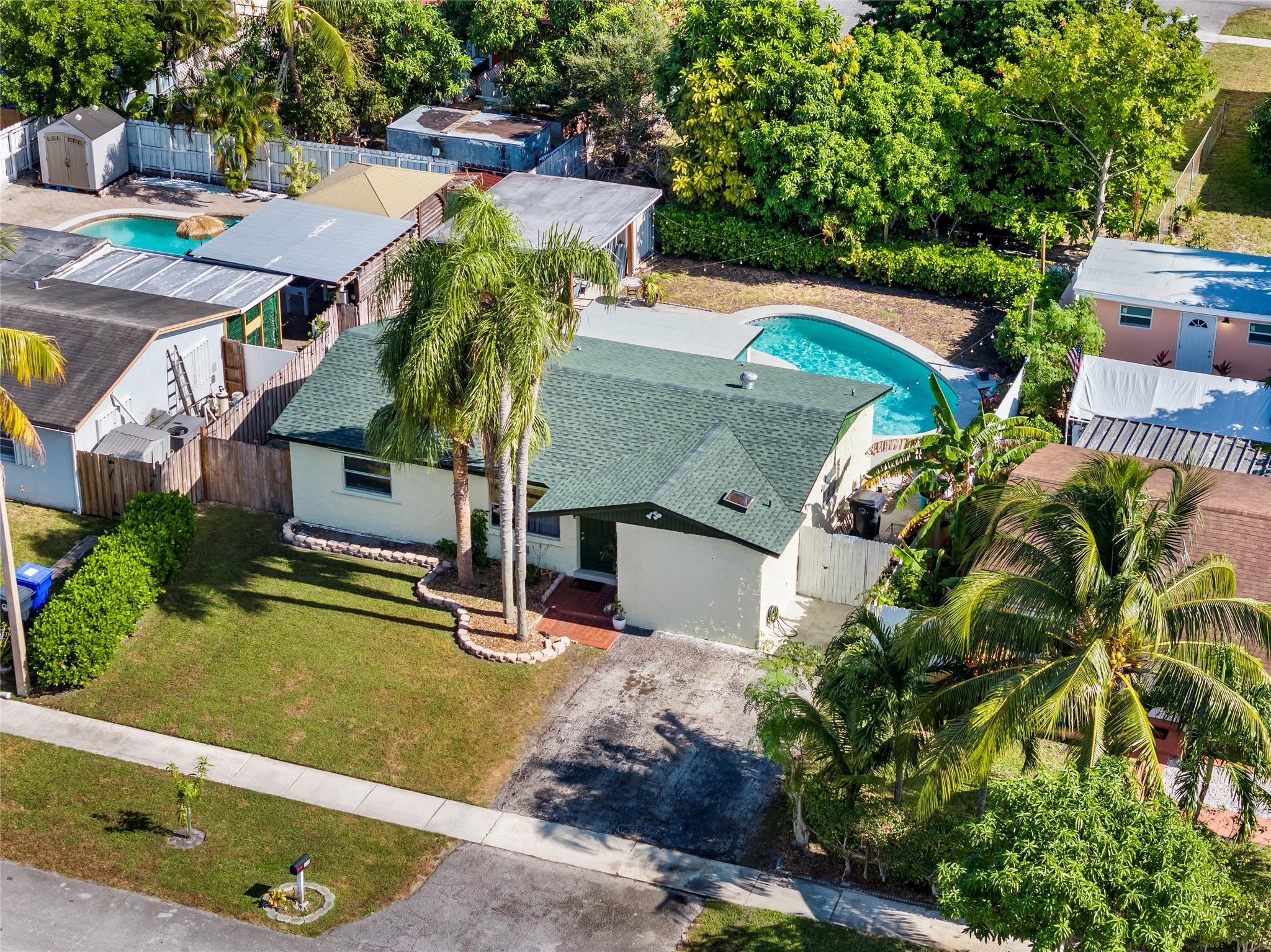 520 Southwest 72nd Terrace North Lauderdale, FL 33068 - Photo 3 of 35 an aerial view of a house with a garden
