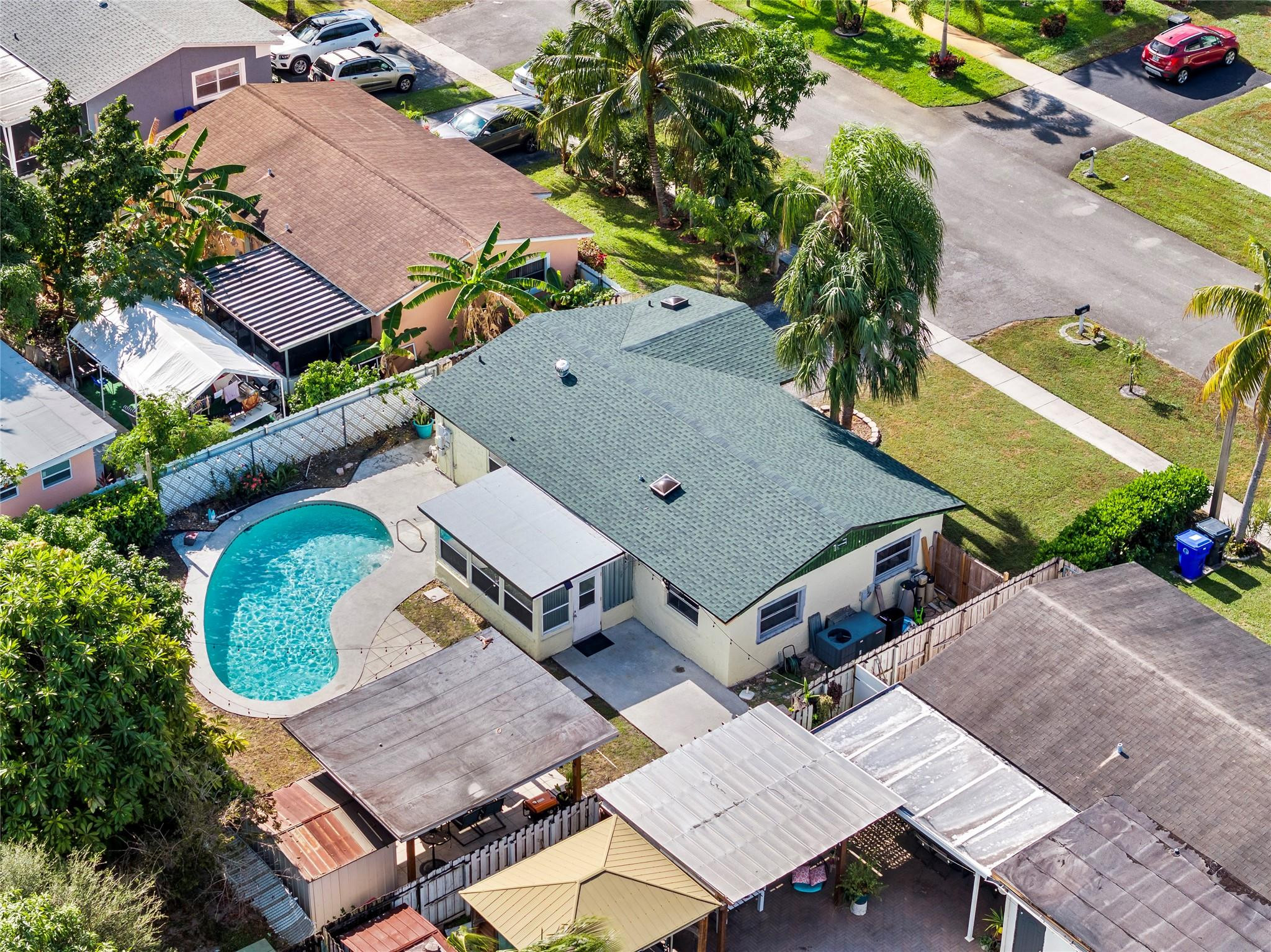 520 Southwest 72nd Terrace North Lauderdale, FL 33068 - Photo 32 of 35 an aerial view of a house with a garden