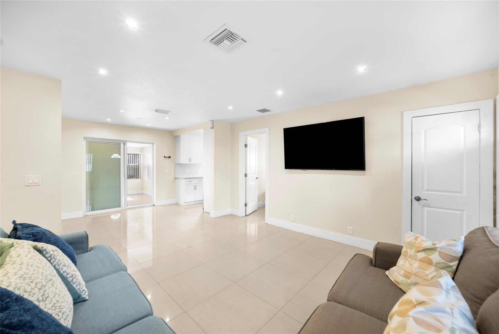 520 Southwest 72nd Terrace North Lauderdale, FL 33068 - Photo 4 of 35 a living room with furniture and a flat screen tv
