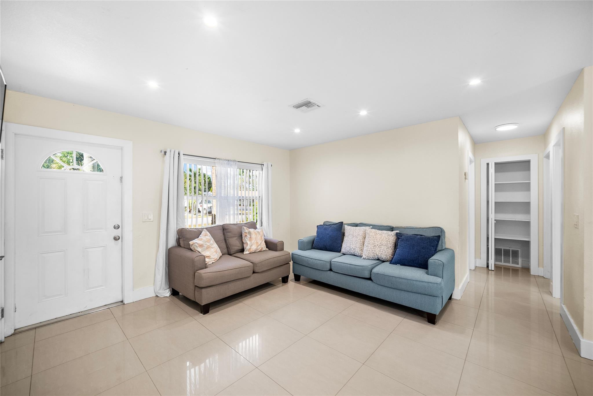 520 Southwest 72nd Terrace North Lauderdale, FL 33068 - Photo 7 of 35 a living room with furniture and a large window