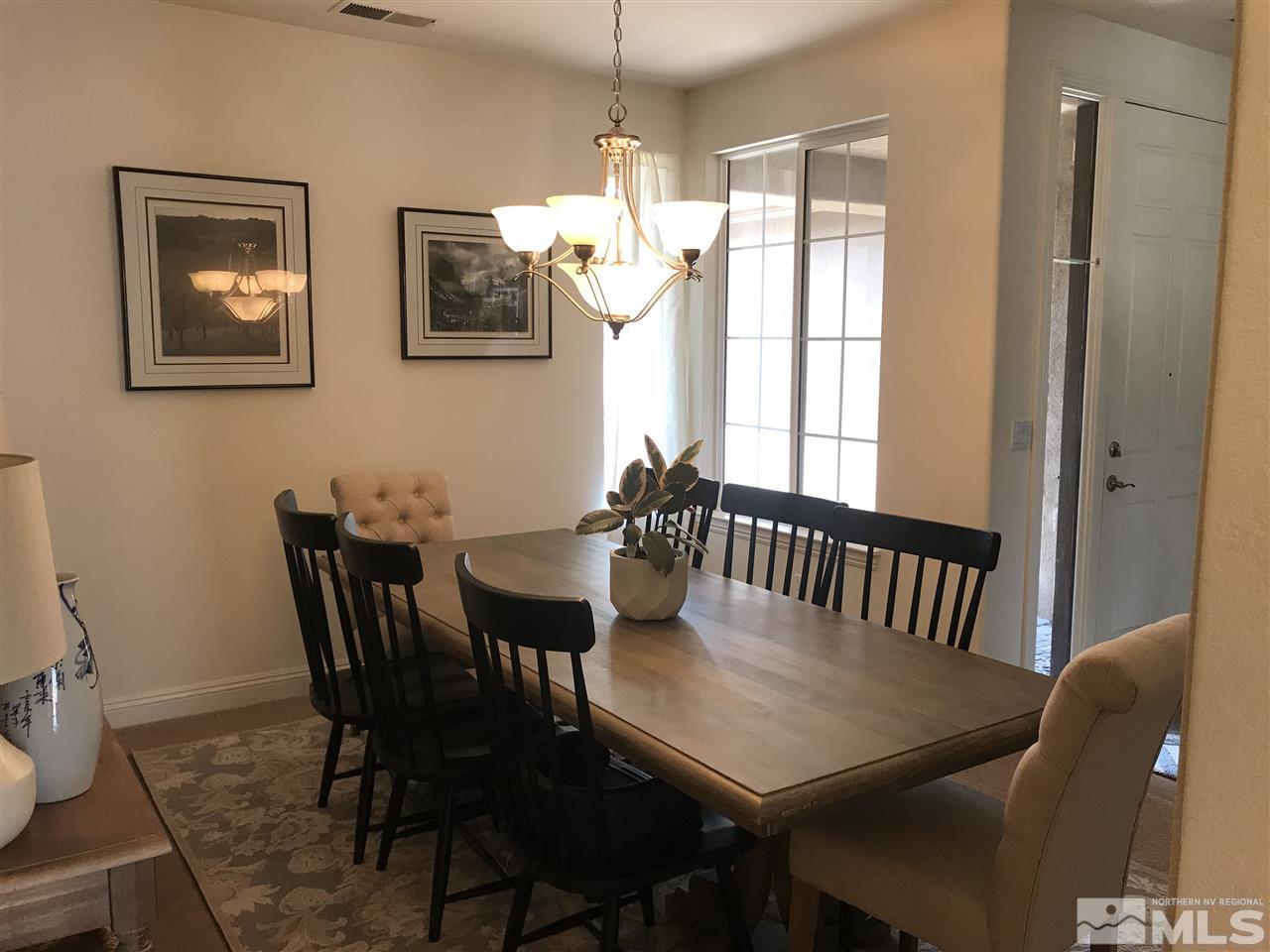 615 Equine Court Reno, NV 89521 - Photo 11 of 25 a view of a dining room with furniture window and outside view