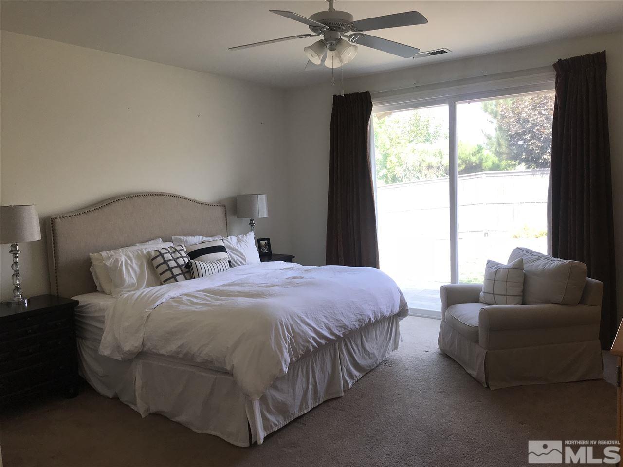 615 Equine Court Reno, NV 89521 - Photo 12 of 25 a bedroom with a bed and a couch