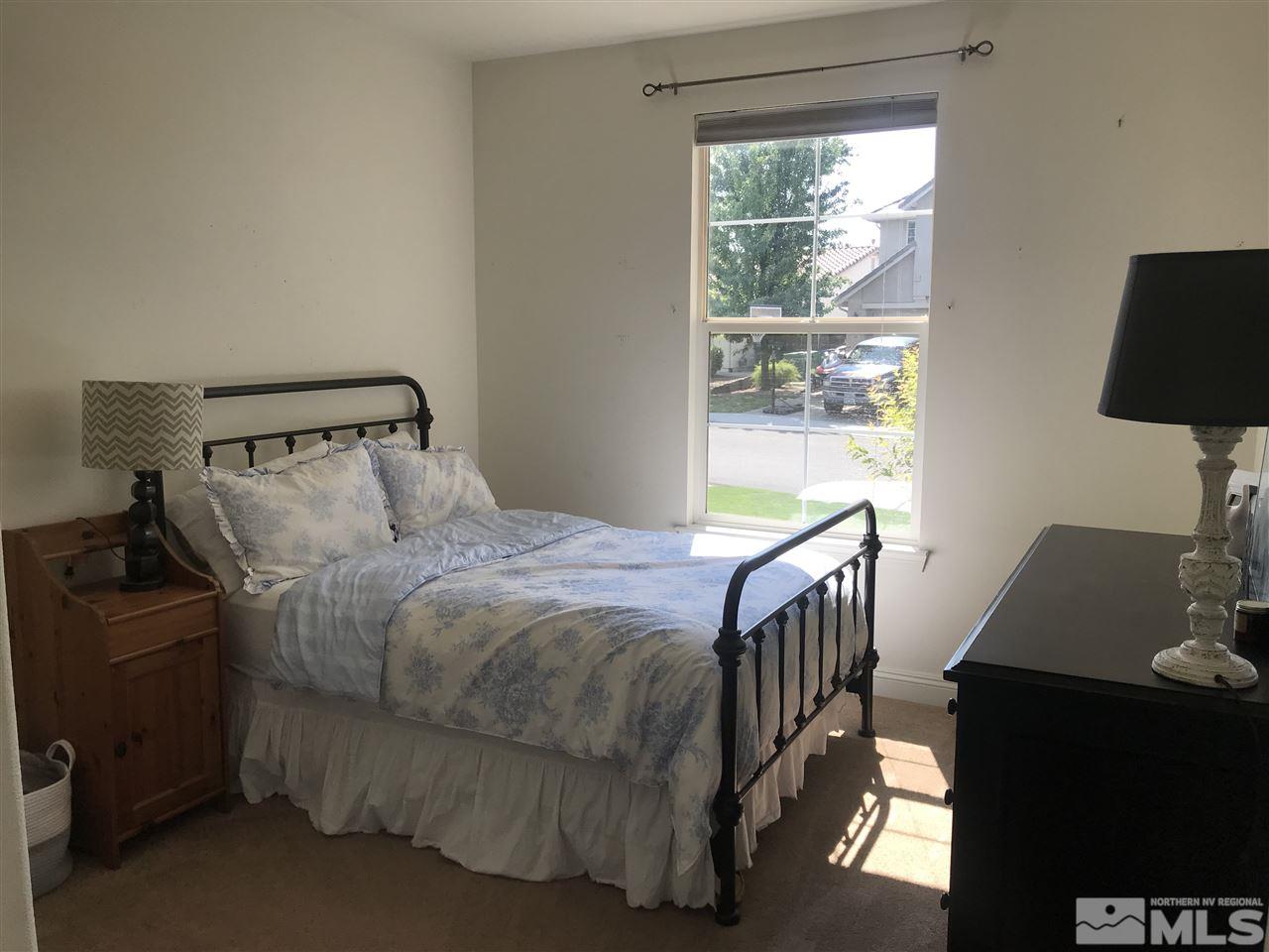 615 Equine Court Reno, NV 89521 - Photo 15 of 25 a bedroom with a bed and a window