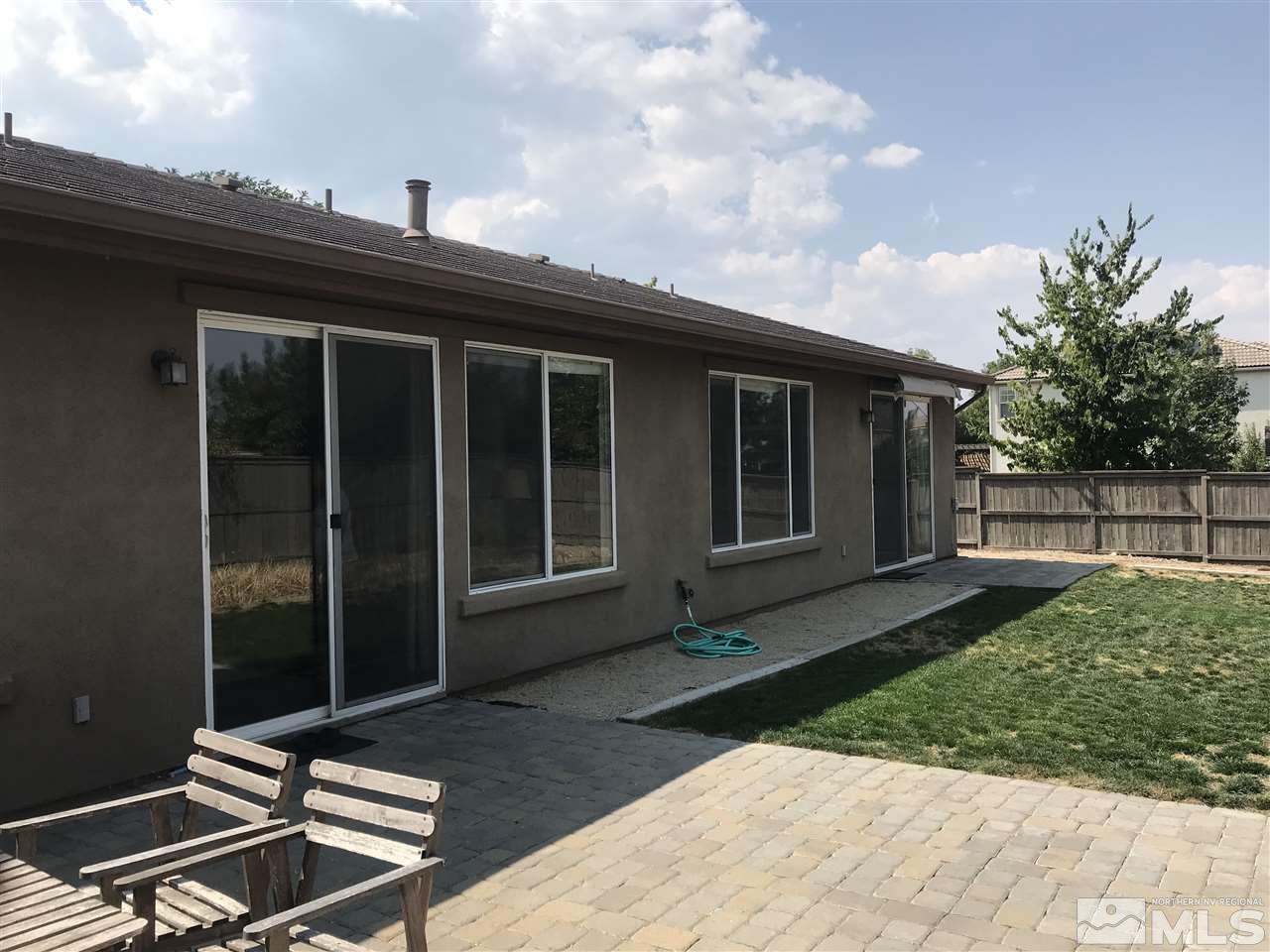615 Equine Court Reno, NV 89521 - Photo 21 of 25 a view of backyard with chair and table